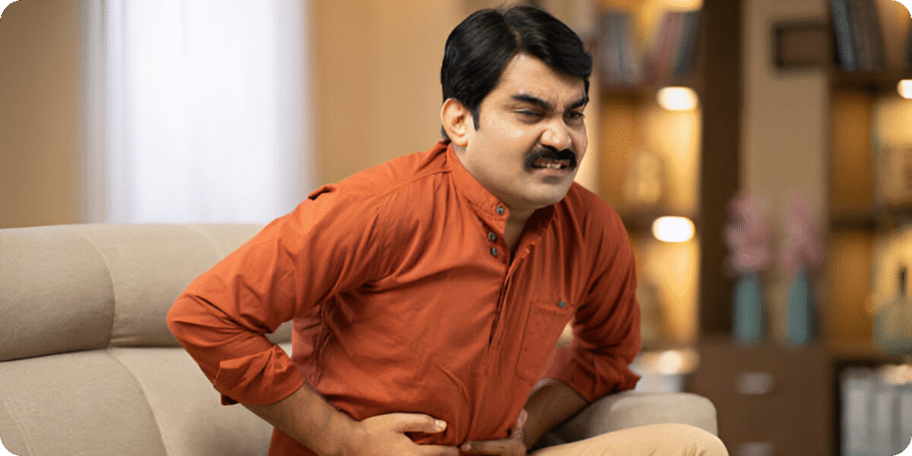 Man suffering IBS - Constipation and having stomach ache.